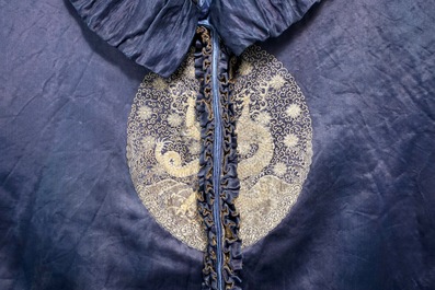 A blue-ground silk coat composed of Imperial Chinese gold thread dragon badges, 19th C.