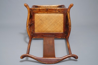 A Chinese elm wood "official's hat" armchair, 19th C.