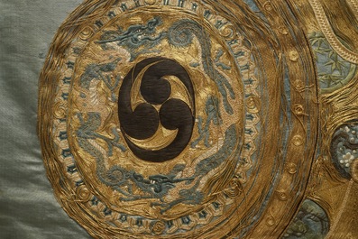 A Japanese silk embroidery depicting a rooster on an o-daiko drum, Edo or Meiji, 19th C.