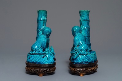 A pair of Chinese turquoise glazed incense holders on wooden stand, 19th C.