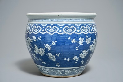 A Chinese blue and white fish bowl with design of prunus on cracked ice, 19th C.