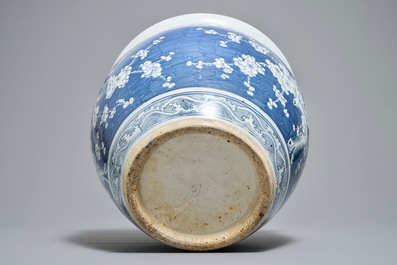 A Chinese blue and white fish bowl with design of prunus on cracked ice, 19th C.