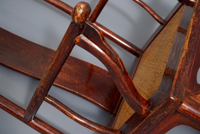 A Chinese elm wood "official's hat" armchair, 19th C.