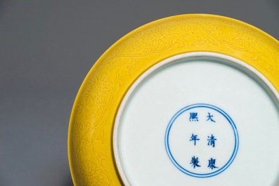 A Chinese monochrome yellow dish with incised lotus design, Kangxi mark, 20th C.