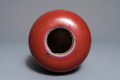 A Chinese monochrome oxblood-glazed jar and cover, 19th C.