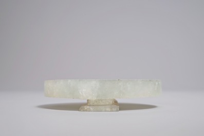 A Chinese green jade belt buckle, 19/20th C.