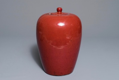 A Chinese monochrome oxblood-glazed jar and cover, 19th C.