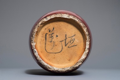 A Chinese monochrome oxblood-glazed jar and cover, 19th C.