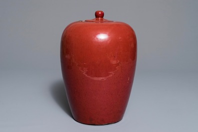 A Chinese monochrome oxblood-glazed jar and cover, 19th C.