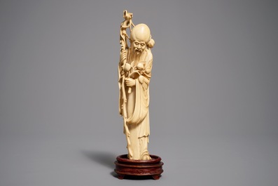Two Chinese carved ivory figures of Shou Lao and Lu Dongbin, 19th C.