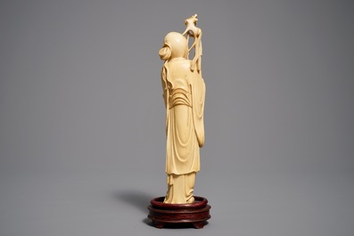 Two Chinese carved ivory figures of Shou Lao and Lu Dongbin, 19th C.