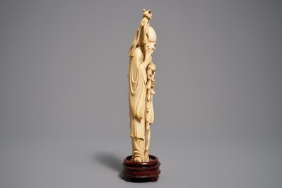 Two Chinese carved ivory figures of Shou Lao and Lu Dongbin, 19th C.