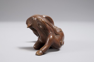 A Chinese bronze scroll or paper weight shaped as a ram, 17/18th C.