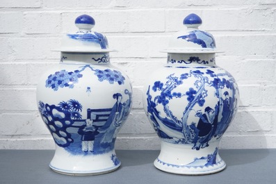Two Chinese blue and white vases and covers with figures, 19th C.