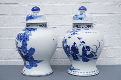 Two Chinese blue and white vases and covers with figures, 19th C.