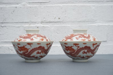 A pair of Chinese iron red dragon bowls and covers, Xianfeng mark, 19/20th C.