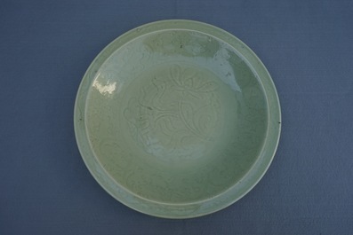 A Chinese Longquan celadon charger with underglaze floral design, Ming