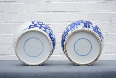 Two Chinese blue and white vases and covers with figures, 19th C.