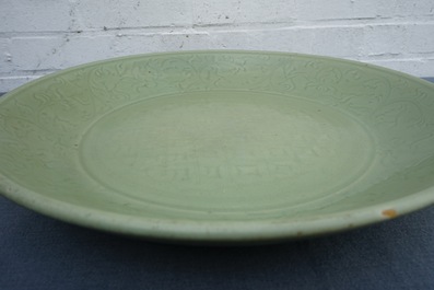 A massive Chinese Longquan celadon dish with underglaze design, Ming