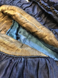 A blue-ground silk coat composed of Imperial Chinese gold thread dragon badges, 19th C.