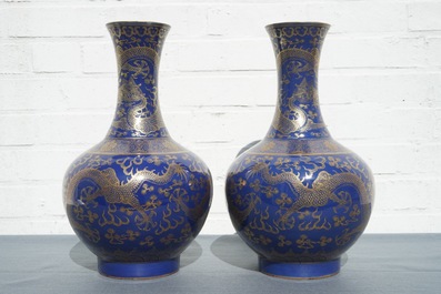 A pair of Chinese monochrome blue vases with gilt dragon design, 19th C.