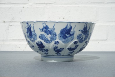 A Chinese blue and white moulded bowl with immortals, Chenghua mark, Kangxi