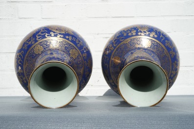 A pair of Chinese monochrome blue vases with gilt dragon design, 19th C.