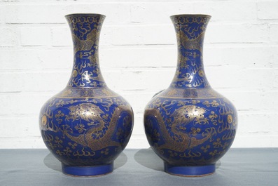 A pair of Chinese monochrome blue vases with gilt dragon design, 19th C.