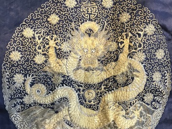 A blue-ground silk coat composed of Imperial Chinese gold thread dragon badges, 19th C.
