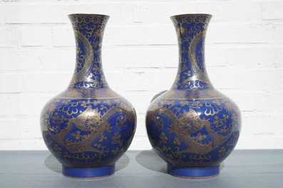 A pair of Chinese monochrome blue vases with gilt dragon design, 19th C.