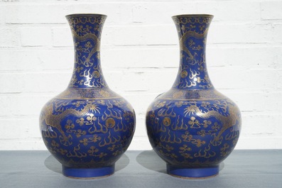 A pair of Chinese monochrome blue vases with gilt dragon design, 19th C.