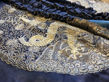 A blue-ground silk coat composed of Imperial Chinese gold thread dragon badges, 19th C.