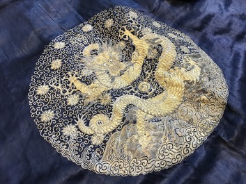 A blue-ground silk coat composed of Imperial Chinese gold thread dragon badges, 19th C.