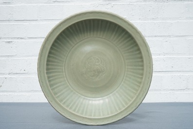 A Chinese Longquan celadon charger with underglaze dragon, Ming