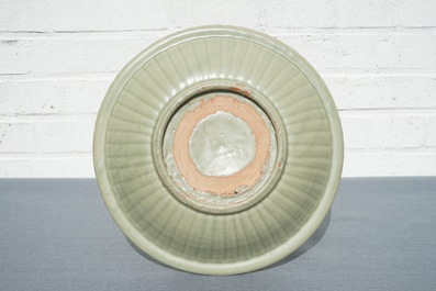 A Chinese Longquan celadon charger with underglaze dragon, Ming