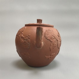 Two Chinese Yixing stoneware teapots with applied floral design, Kangxi