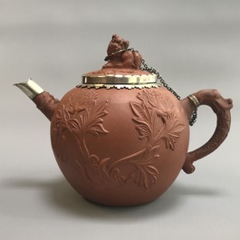 Two Chinese Yixing stoneware teapots with applied floral design, Kangxi