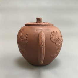 Two Chinese Yixing stoneware teapots with applied floral design, Kangxi