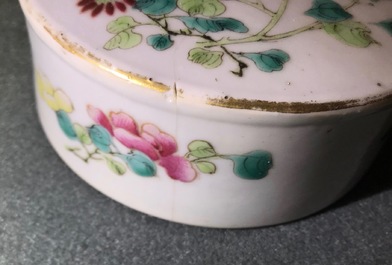 A pair of Chinese famille rose jars and covers with insects and flowers, Qianlong mark, 19/20th C.