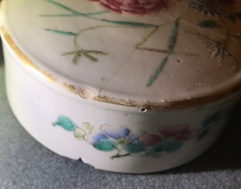 A pair of Chinese famille rose jars and covers with insects and flowers, Qianlong mark, 19/20th C.
