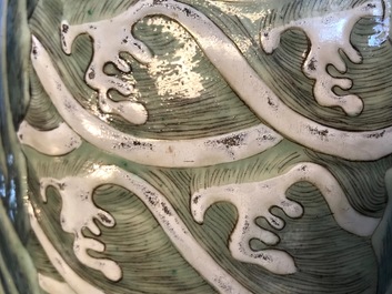 A Chinese famille rose rouleau vase with applied design of mythical beasts, Qianlong mark, 19th C.