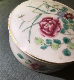 A pair of Chinese famille rose jars and covers with insects and flowers, Qianlong mark, 19/20th C.