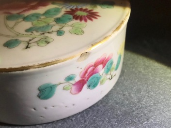 A pair of Chinese famille rose jars and covers with insects and flowers, Qianlong mark, 19/20th C.