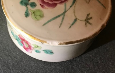 A pair of Chinese famille rose jars and covers with insects and flowers, Qianlong mark, 19/20th C.