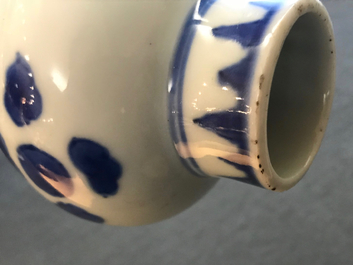 A Chinese blue and white bottle vase with floral design, Transitional period