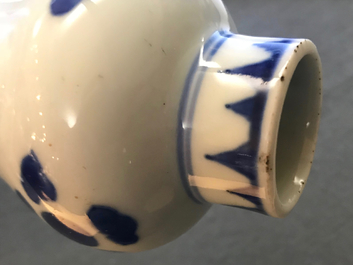A Chinese blue and white bottle vase with floral design, Transitional period
