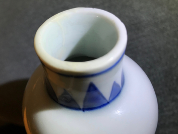 A Chinese blue and white bottle vase with floral design, Transitional period