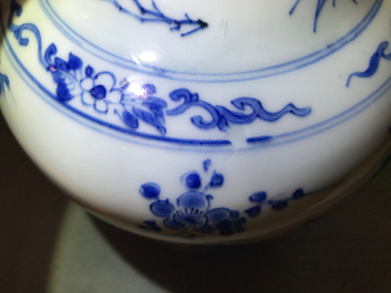 A Chinese blue and white bottle vase with floral design, Transitional period