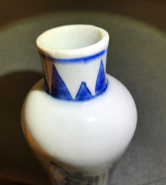 A Chinese blue and white bottle vase with floral design, Transitional period