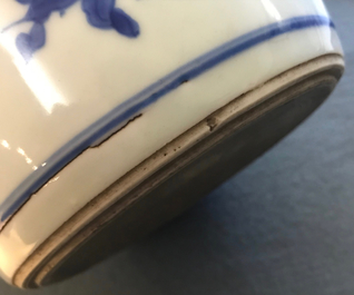A Chinese blue and white bottle vase with floral design, Transitional period